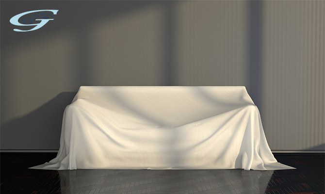 A sofa covered with white cloth in a living room