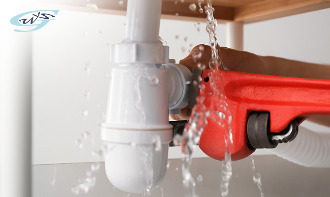 Water leaking from the plastic bottle trap below a sink