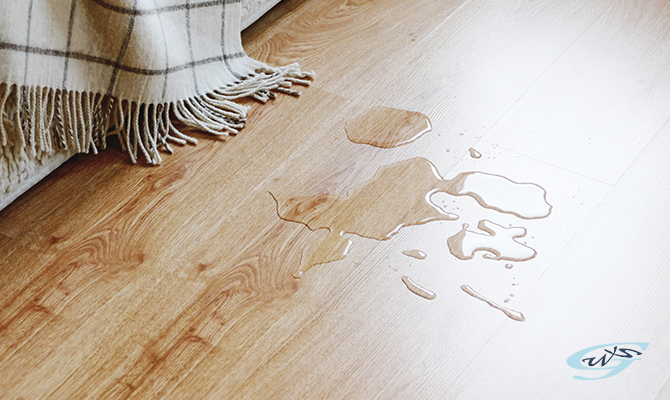 Water puddles on the floor due to a roof leakage