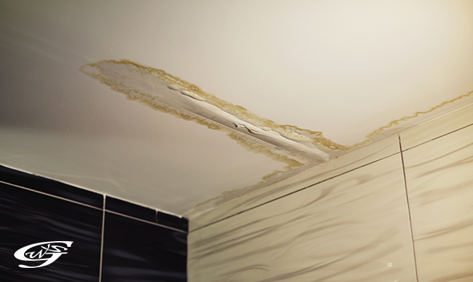 Yellow and brown stains on the ceiling due to leakage