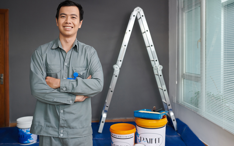 Professional painter ready to solve paint bubbling and waterproofing issues